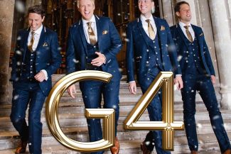 G4 concert graphic featuring the G4 logo & 4 men walking out of an old doorway to another Cathedral. Image features a flocked snow effect.