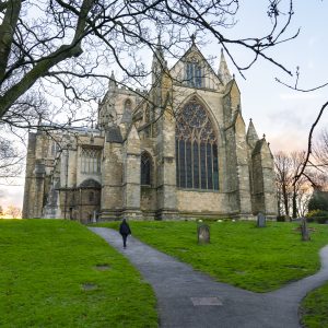 Ripon Cathedral's East End taken from the bottom of the hill in the Churchyard looking east. Image was taken in the winter and features grey skies & trees with no leaves.